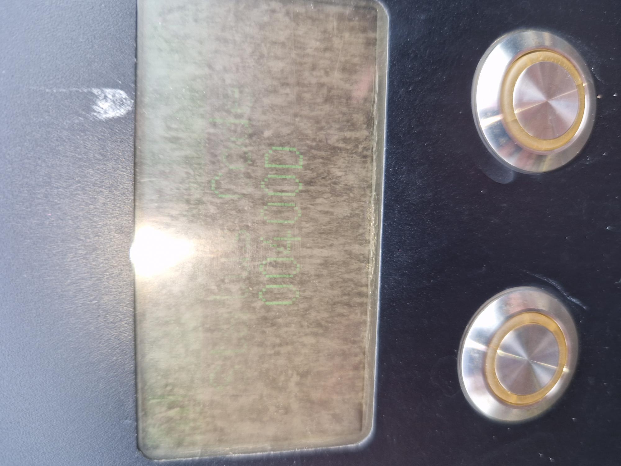 Delta DC charge point display showing error code 00400D behind a clouded window